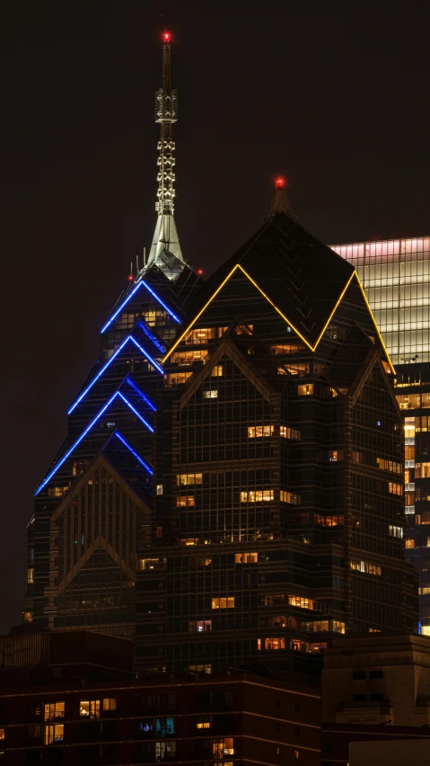 the top of a building with lights on at night