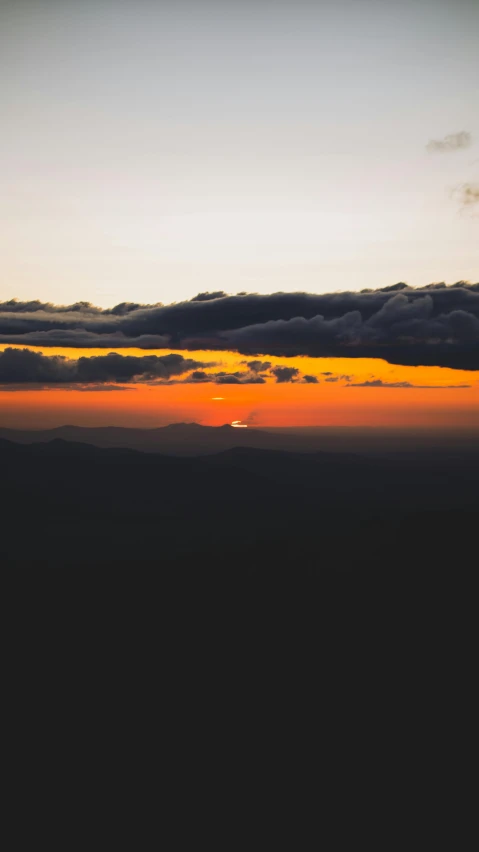 sunset in the sky from the airplane's window