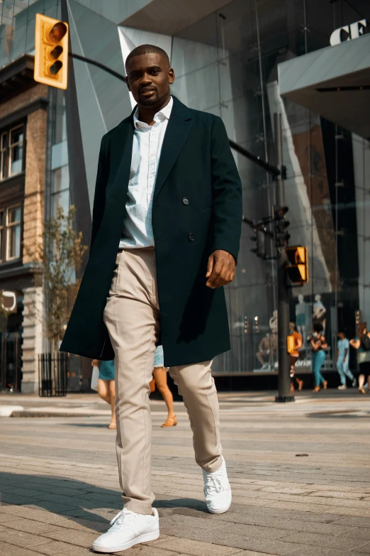 a man is standing alone in a city setting