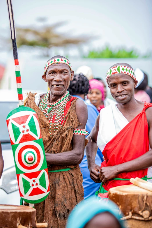 a group of people dressed in african regalia