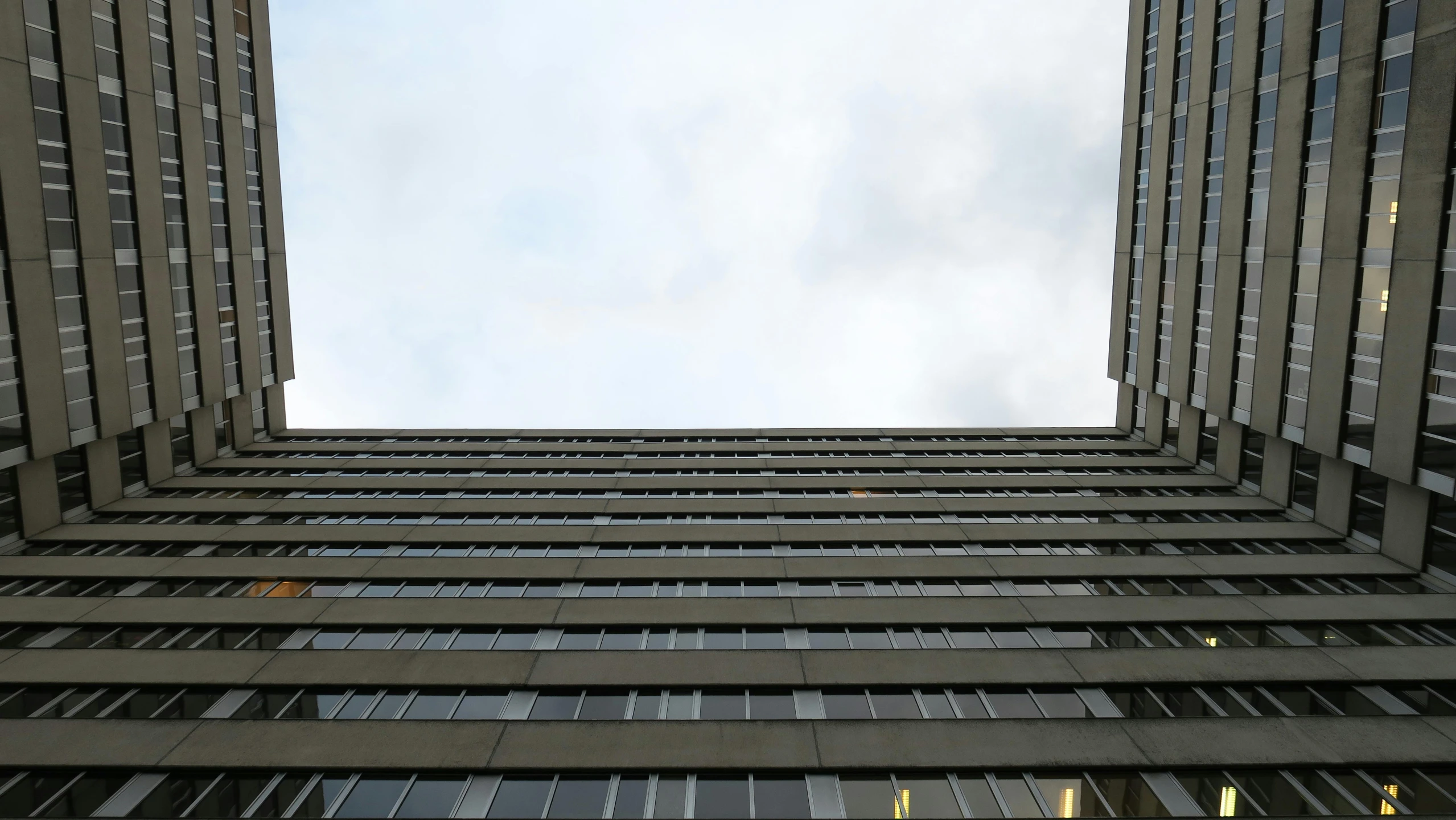 a tall building that is surrounded by several floors