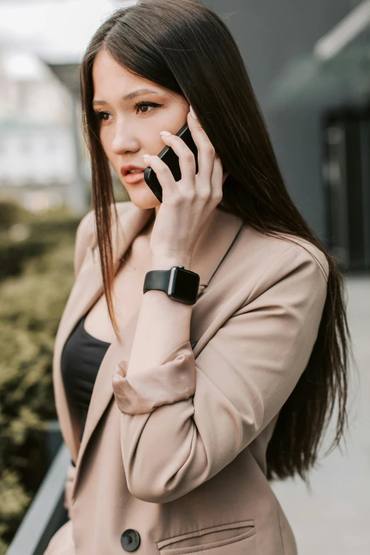 a woman is talking on her cell phone