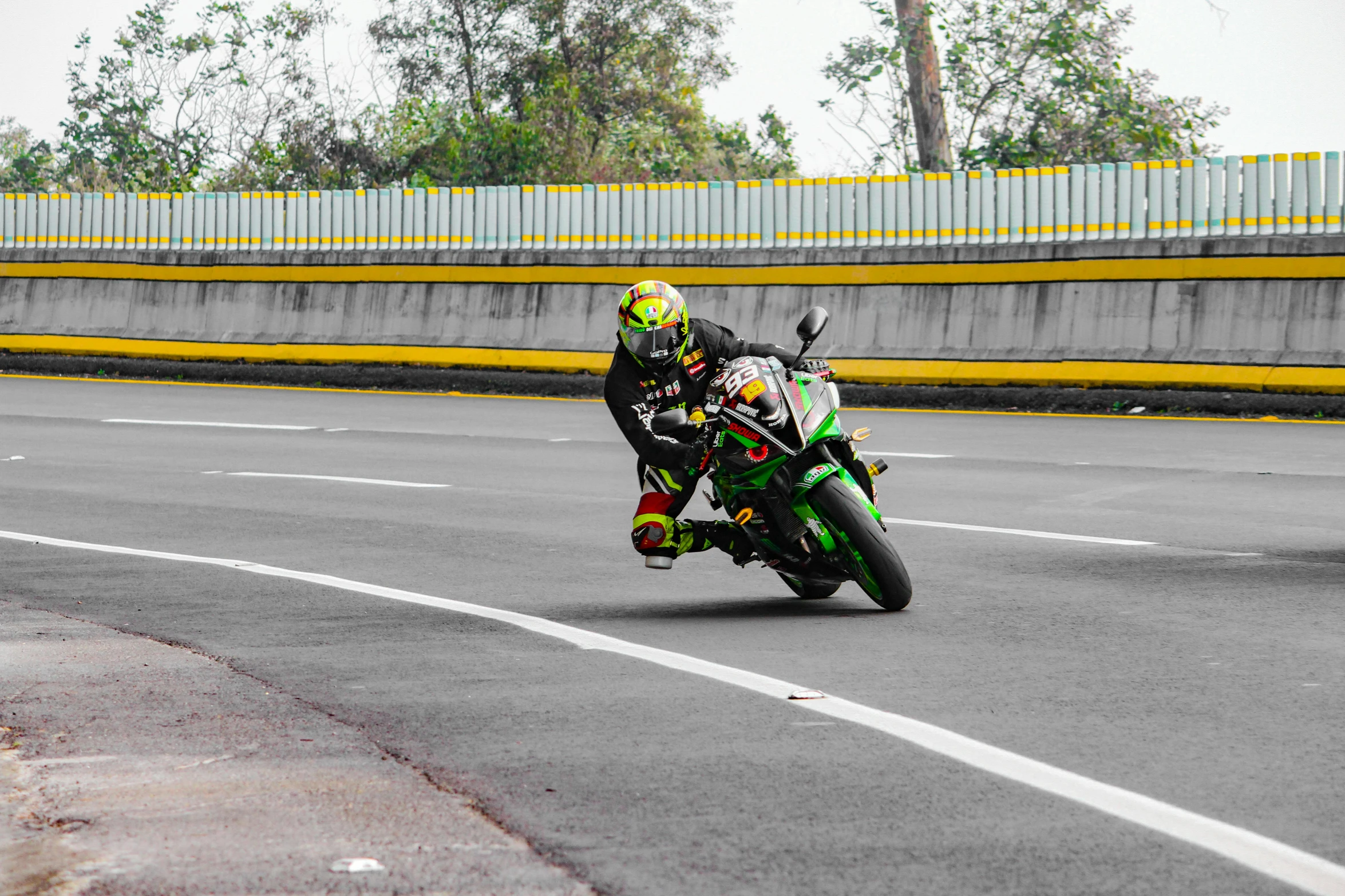 two people on motor bikes race down a road