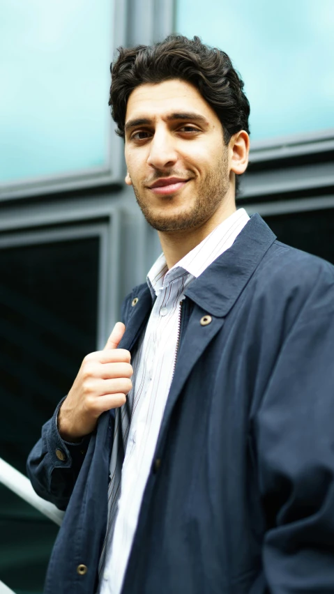 an image of a man with suit on smiling