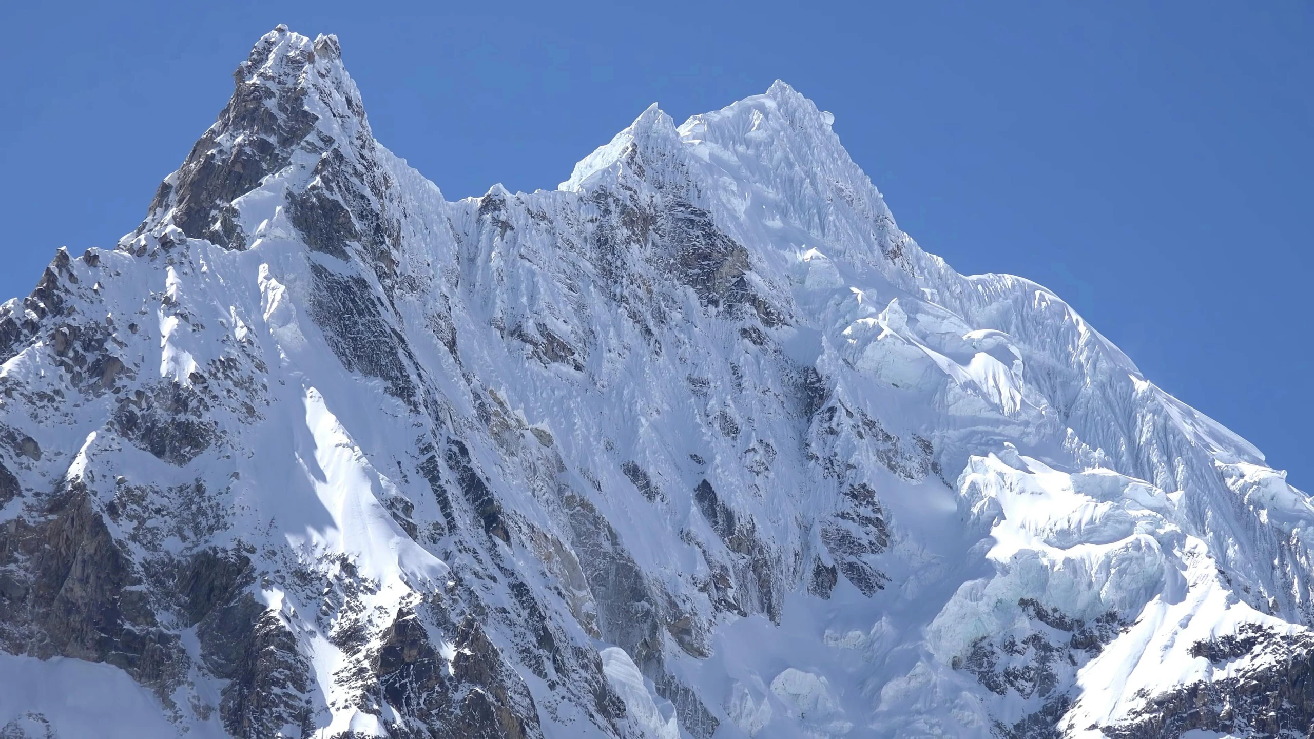 the view from the bottom of a large snowy mountain