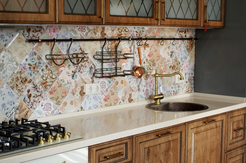 an old kitchen has floral walls and cabinets