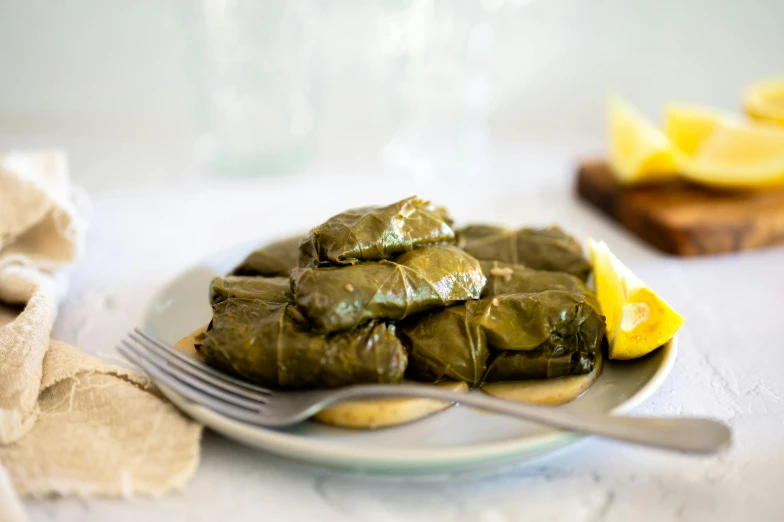 a plate of food with sauce and yellow spoon