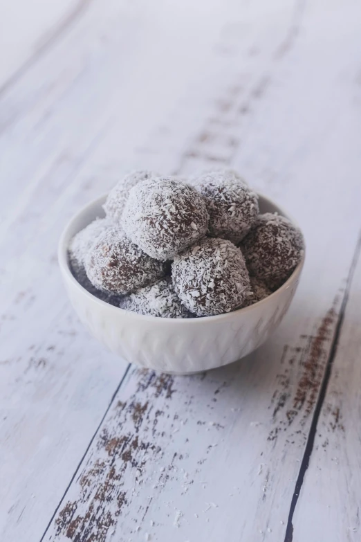 a small bowl with brown powdered sugar on top of it