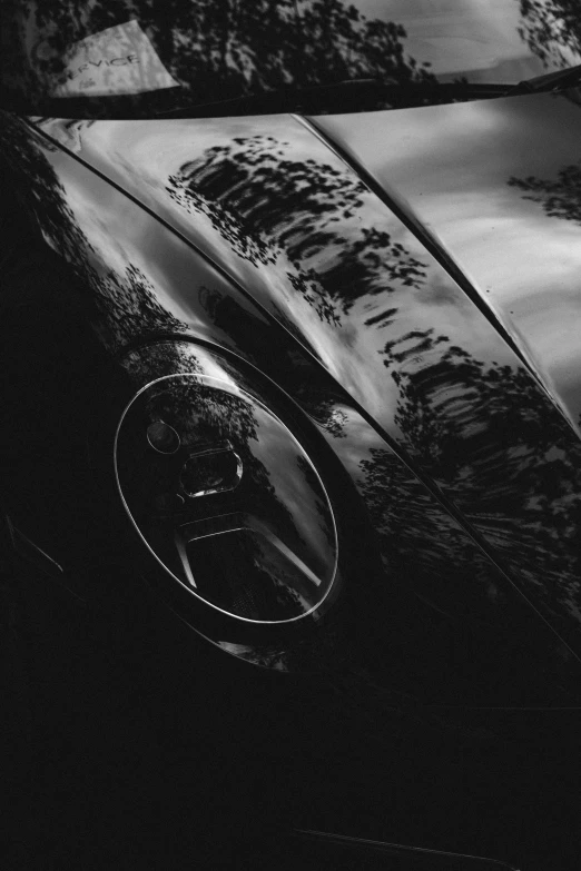 the front of an old classic car in black and white