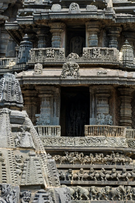 close up image of ornate architecture at the top of a building