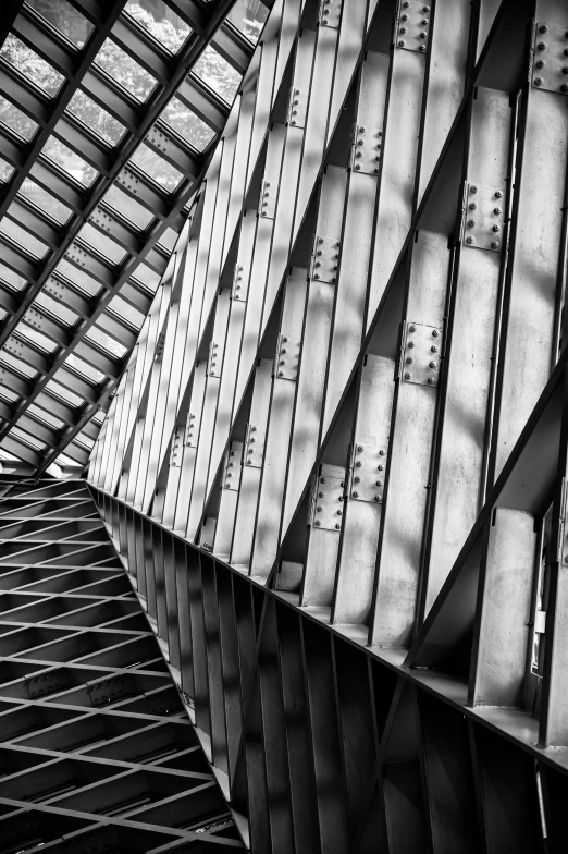 a black and white po of an art museum that has very long columns