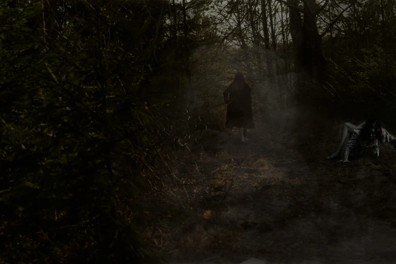 a person walks through a forest holding their jacket