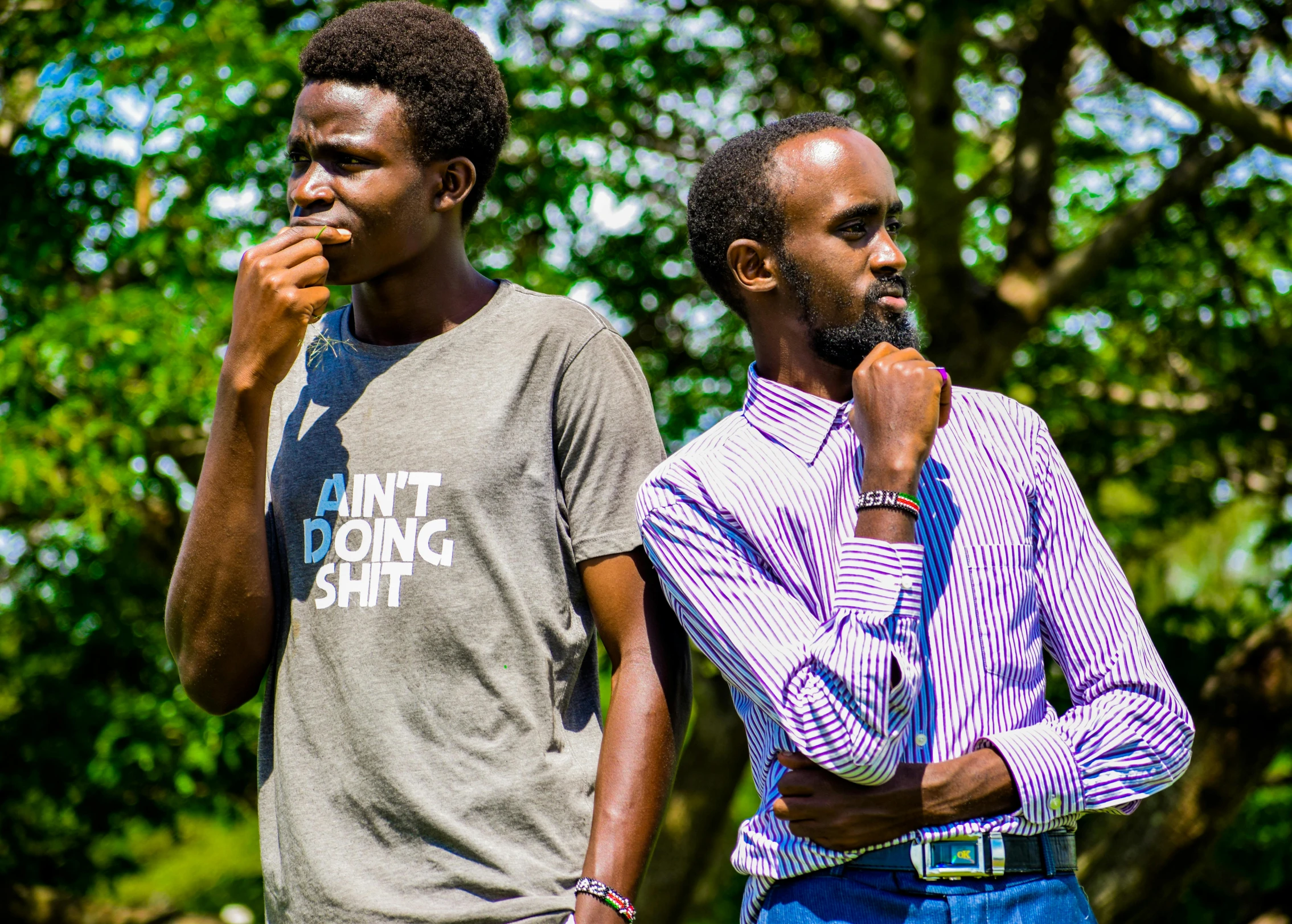 two african men are standing next to each other