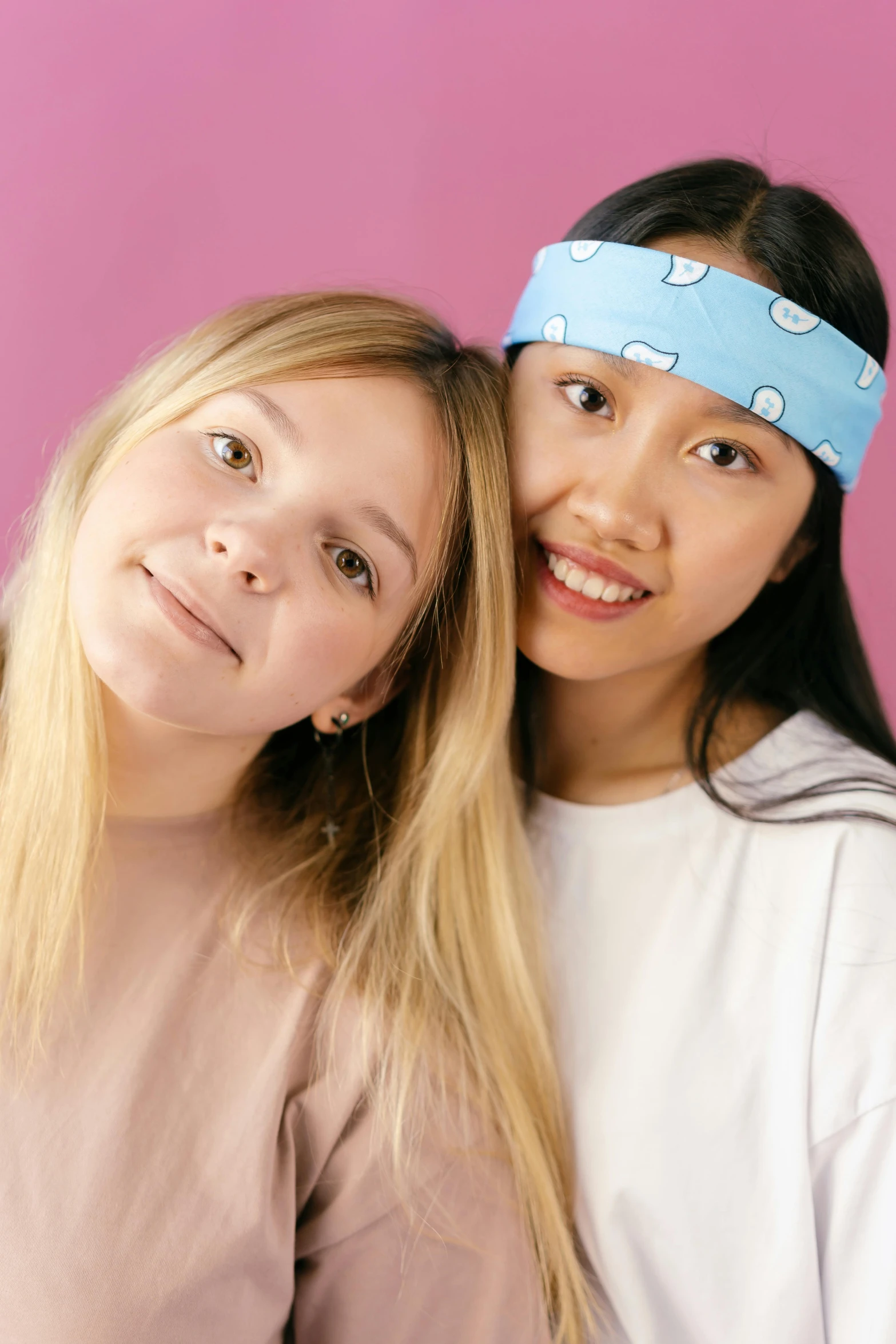 two s wearing headbands standing together