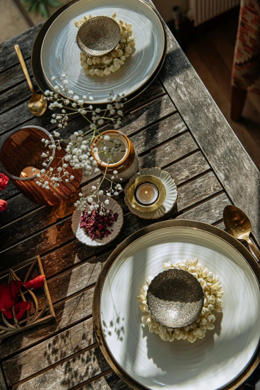 a table topped with plates and bowls filled with food