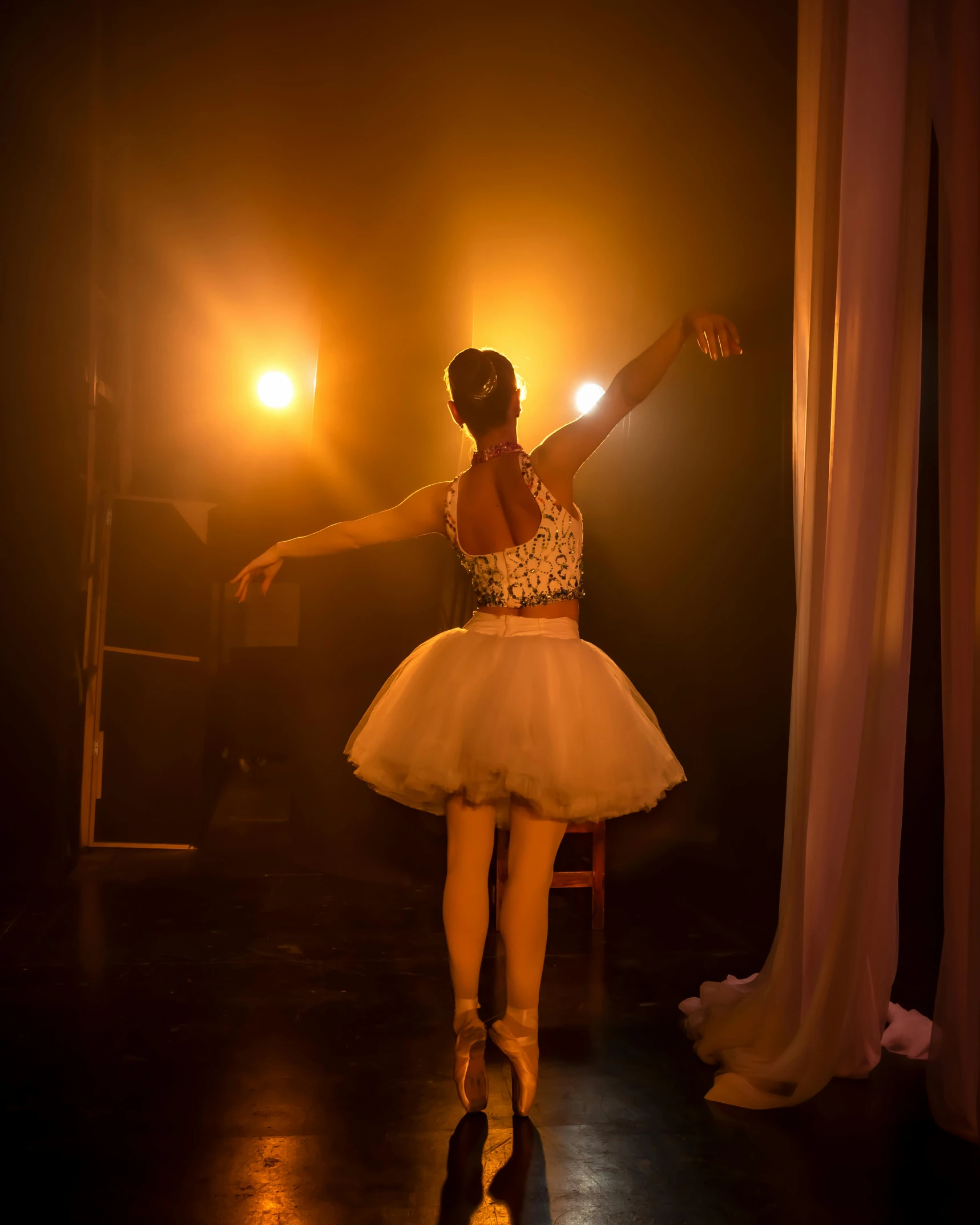 a ballet woman with arms in the air