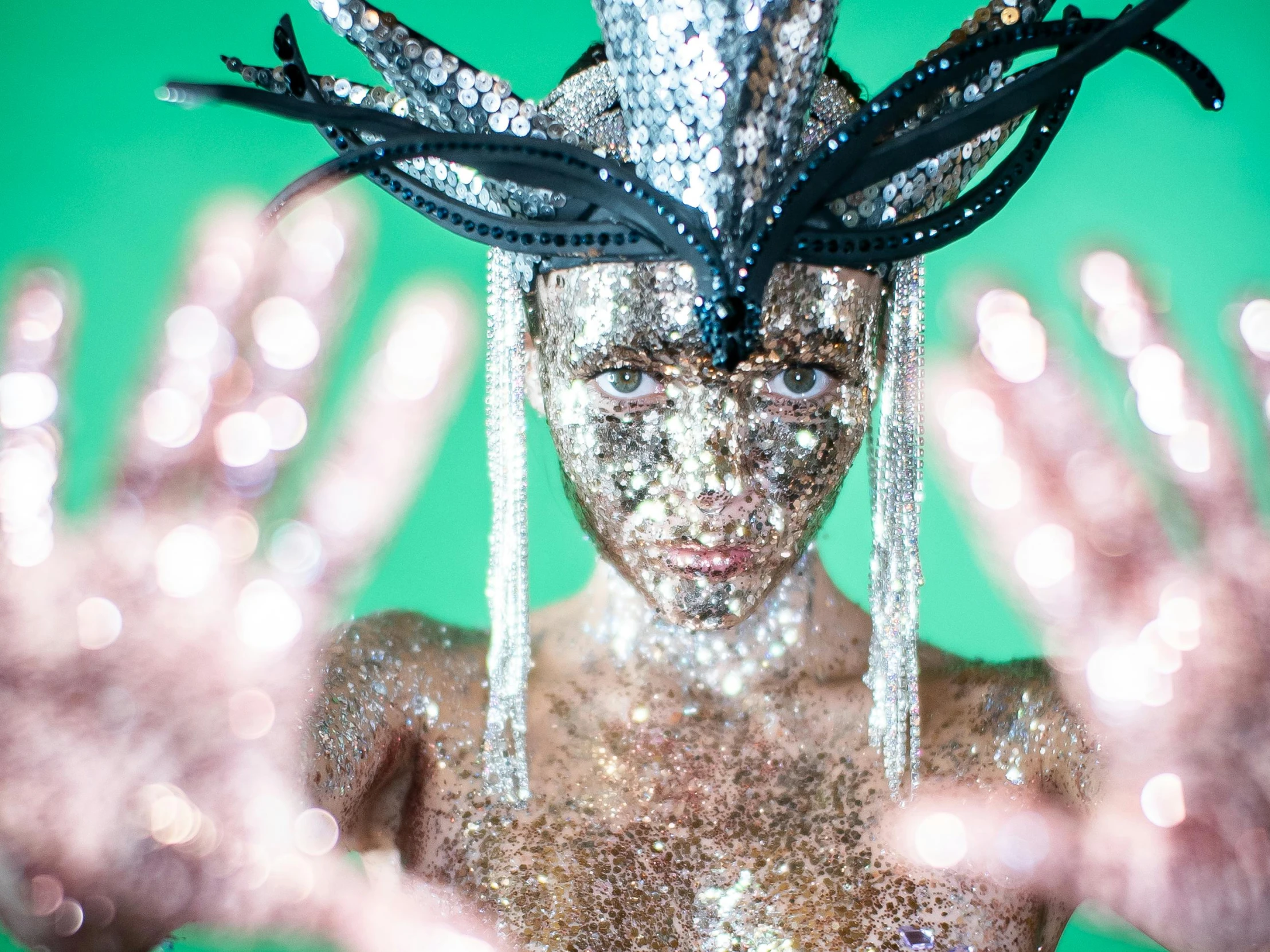 a woman with her hands in front of her face