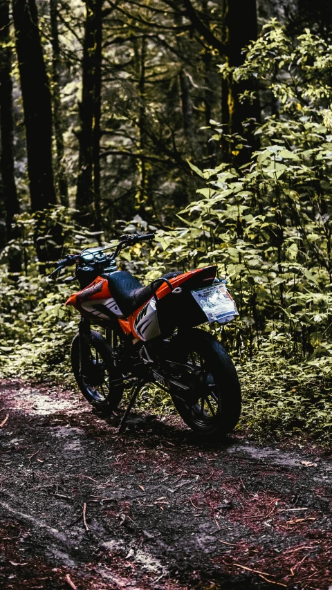 a motorcycle that is standing in the dirt