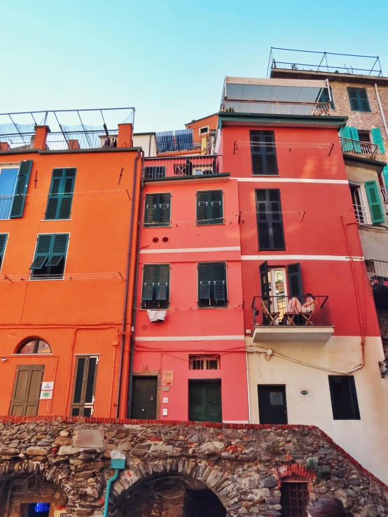 some buildings and people walking around the town