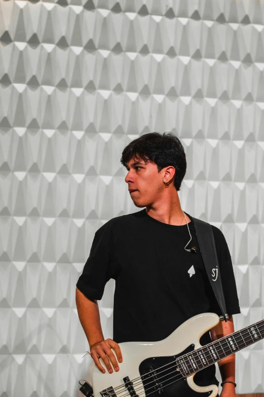 a man is playing an electric guitar on stage