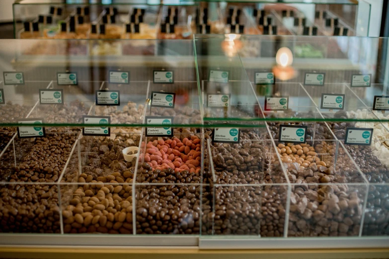 assorted fruits displayed in a display case for sale