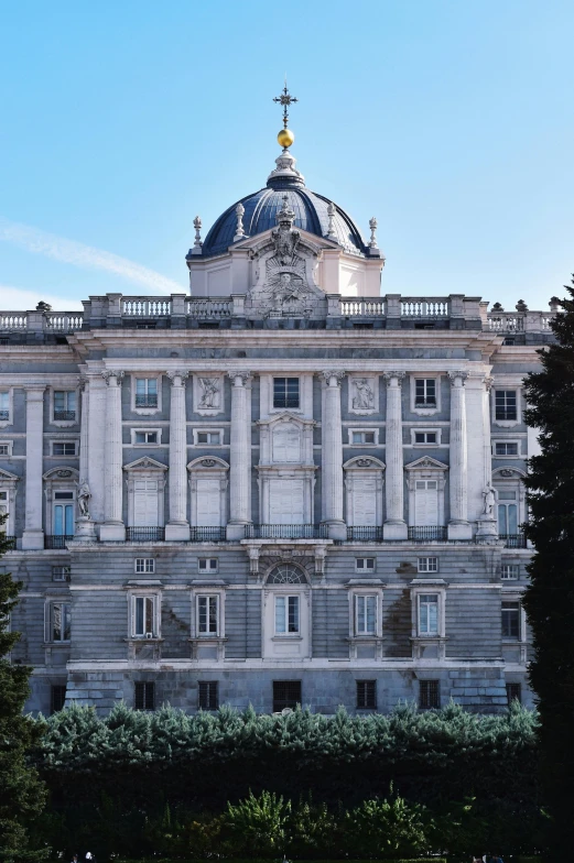 a large building with many windows and an umbrella