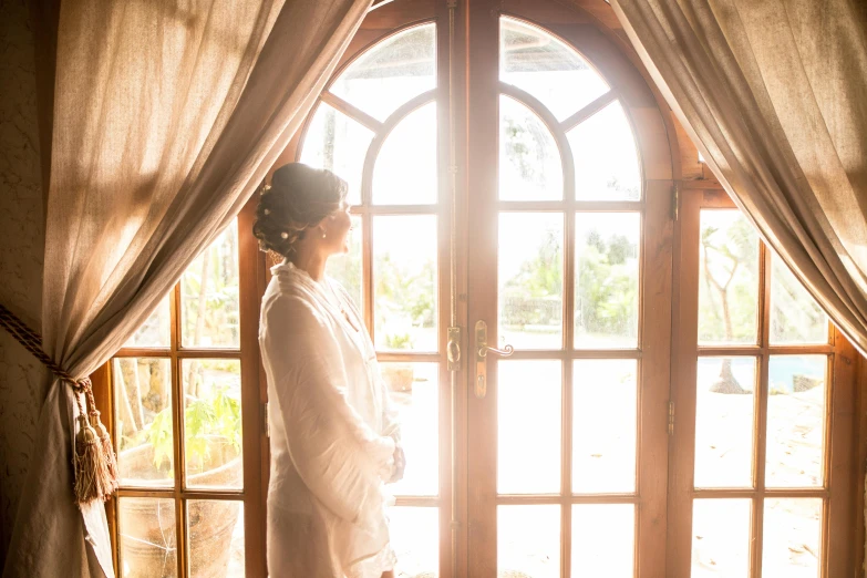 a woman standing in front of an open door