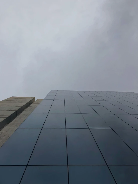 the face of an airplane is reflected in a window