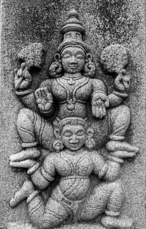 a black and white po of a statue of hindu deities