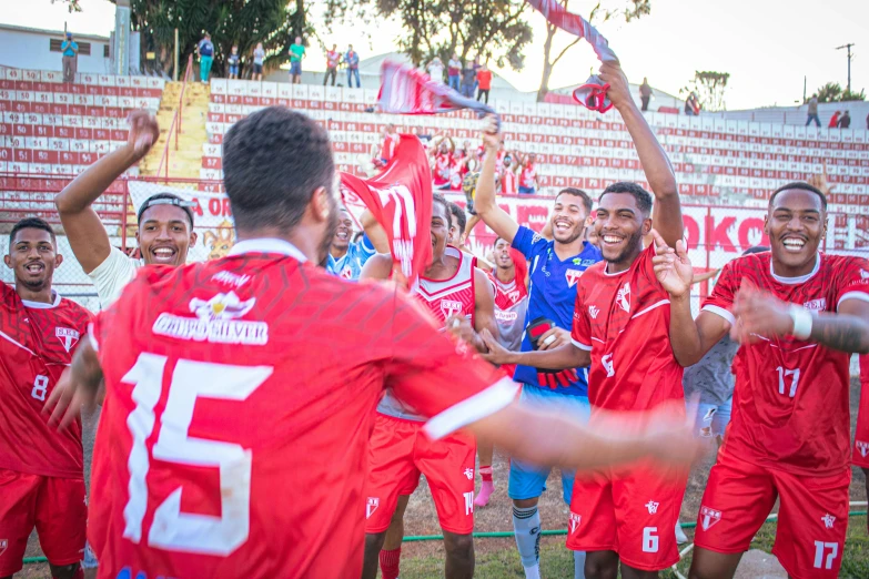 the men's soccer team is celeting after a victory