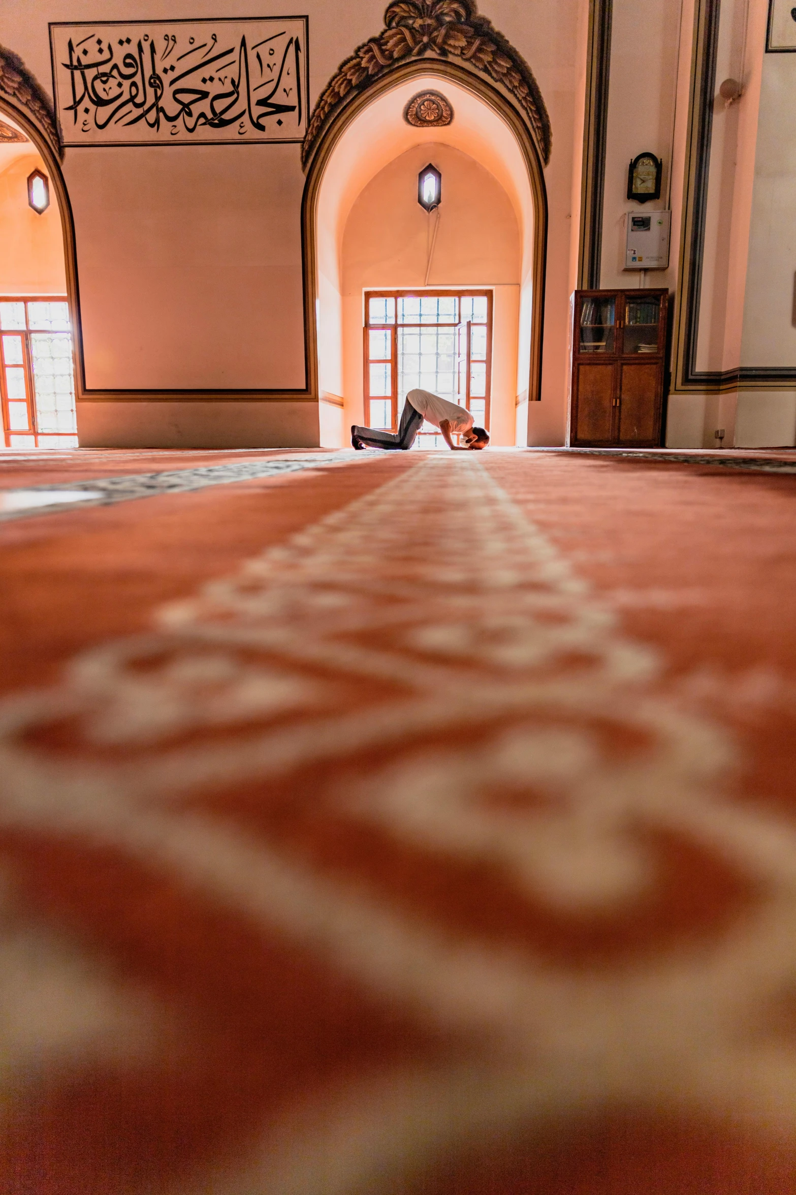 a person lying on the floor near a doorway