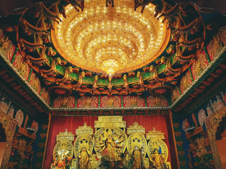 an ornate golden alter in a church