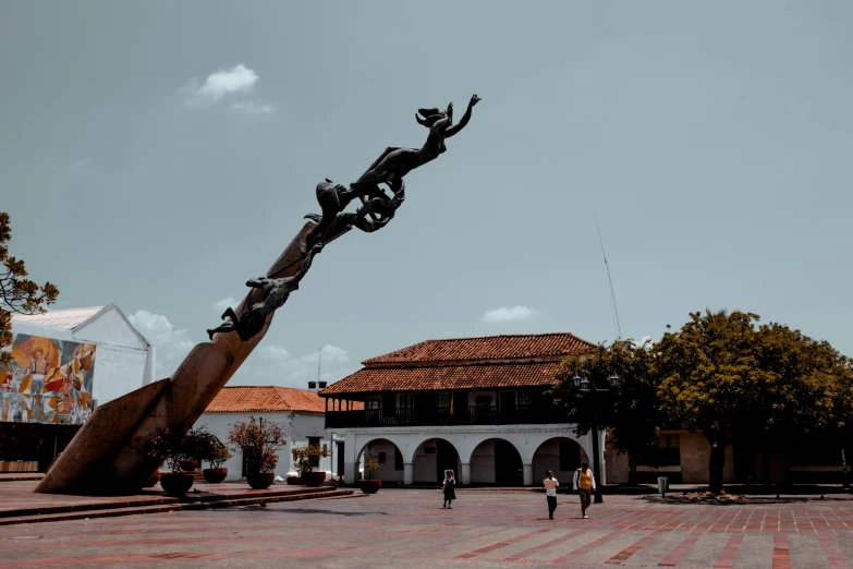 the statue is of a woman on a bike