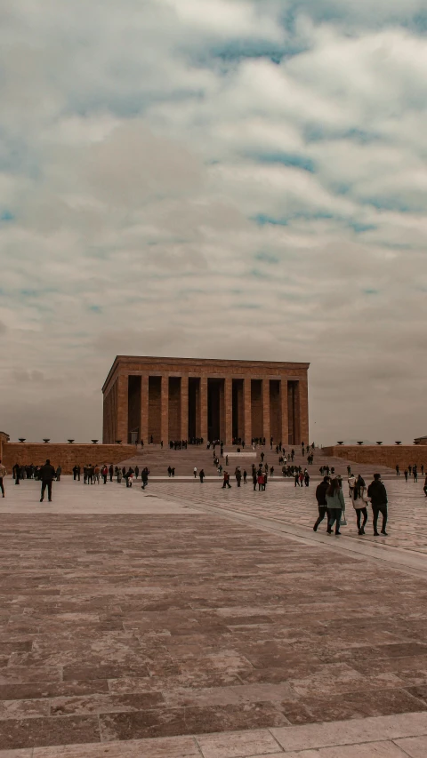 a bunch of people walking near a building