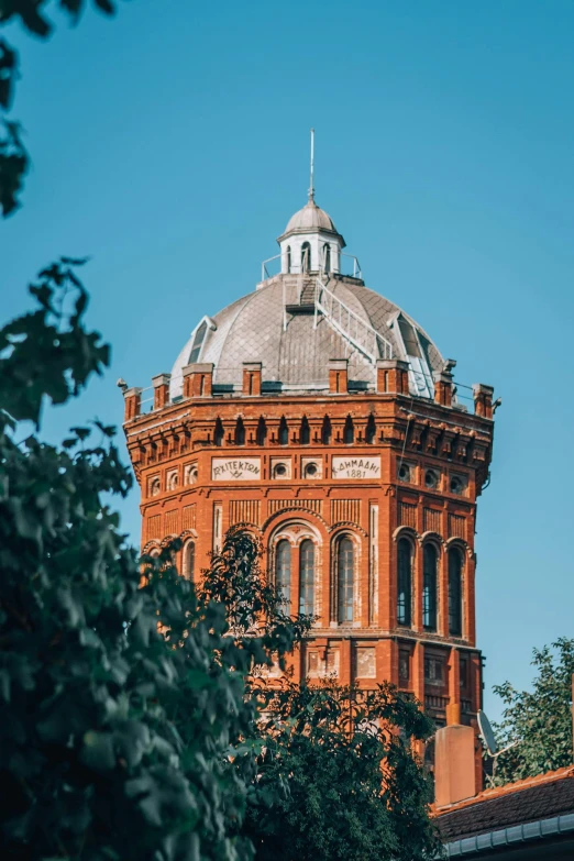 the dome of an old building has a sky background