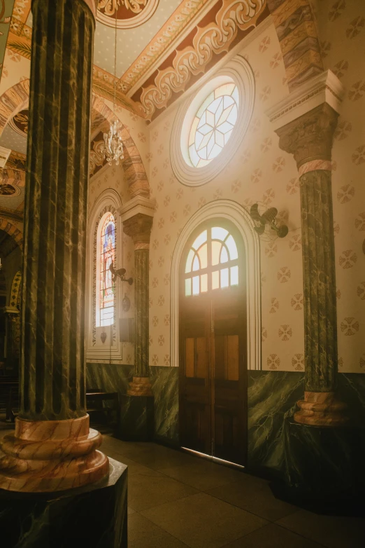 a room with high ceilings and two large windows