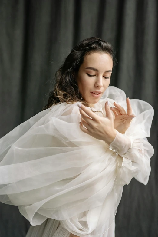 a woman in a dress posing for the camera