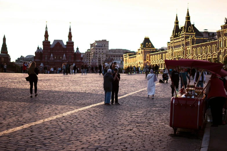 people walking around an old fashioned market square