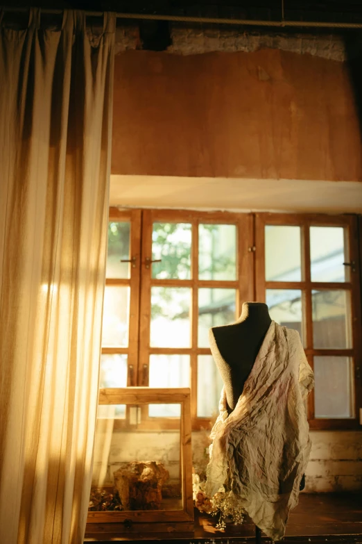 the back and side of a display case containing a mannequin