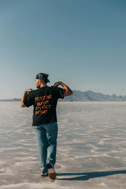 a man walks across some flat ground