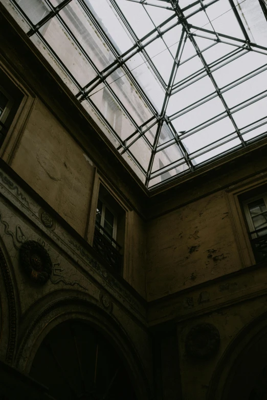 an old building with a big glass roof