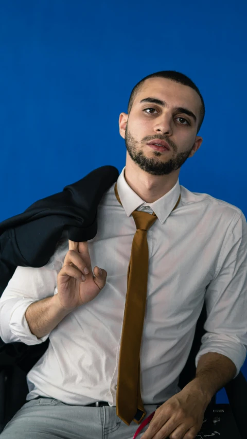 a man with a beard in shirt and tie