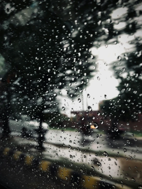 the windshield of a car with rain on it