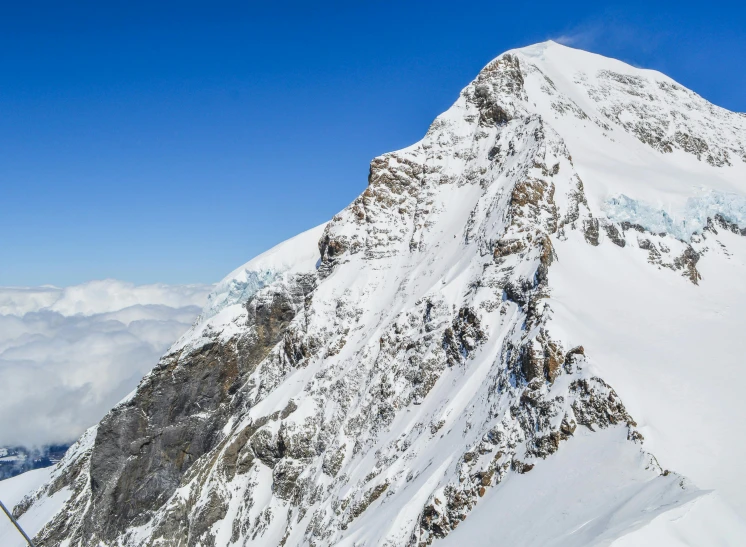 a snowy mountain that is very steep and clear