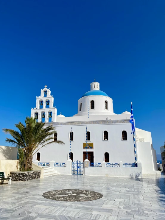 an ornate white building with three arches in front