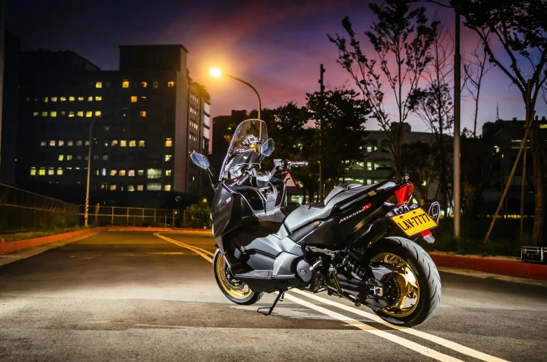 a motorcycle parked on the street at night