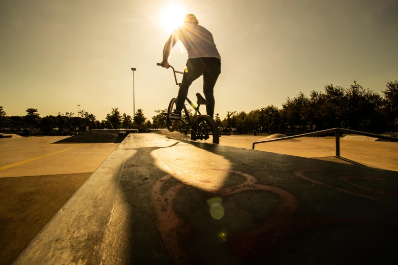 someone riding on their bike at the skate park