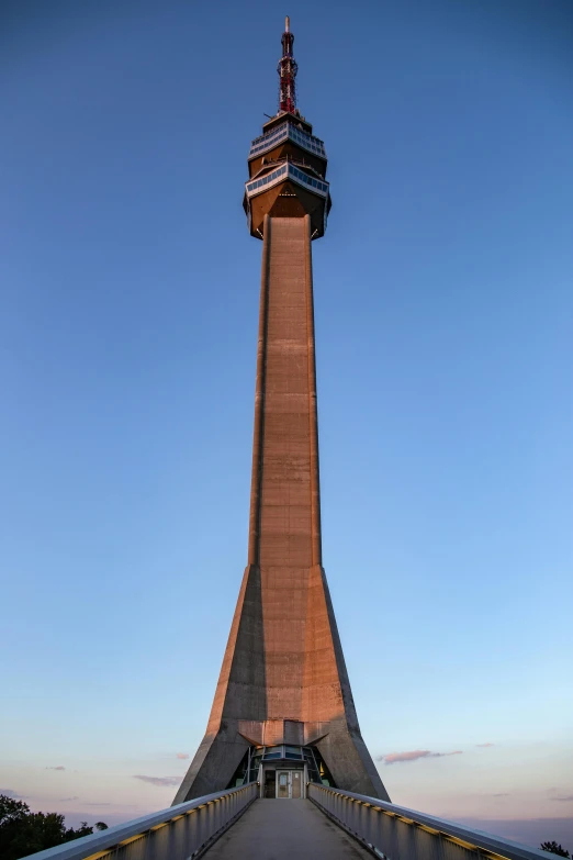 an overpass leads to a tower that stands at the top