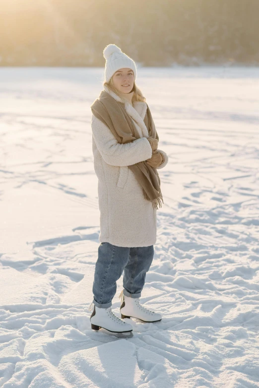 the woman smiles in the open space covered with snow