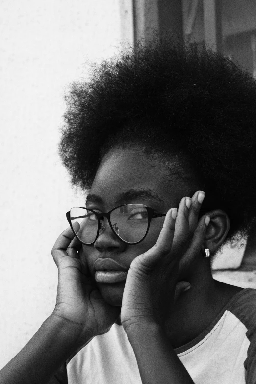 an african american woman in glasses with an afro hairdo